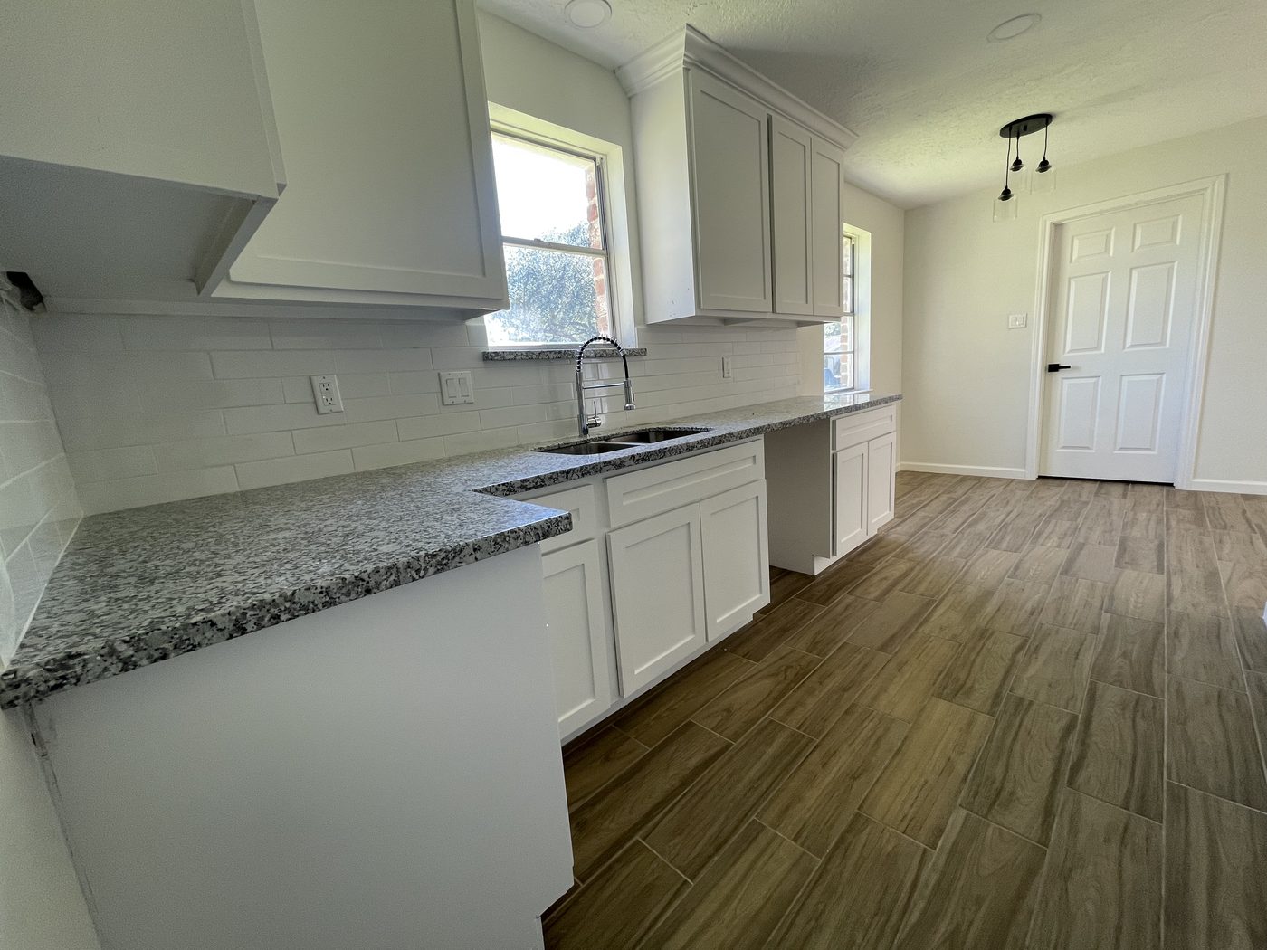 Finished kitchen with granite counters