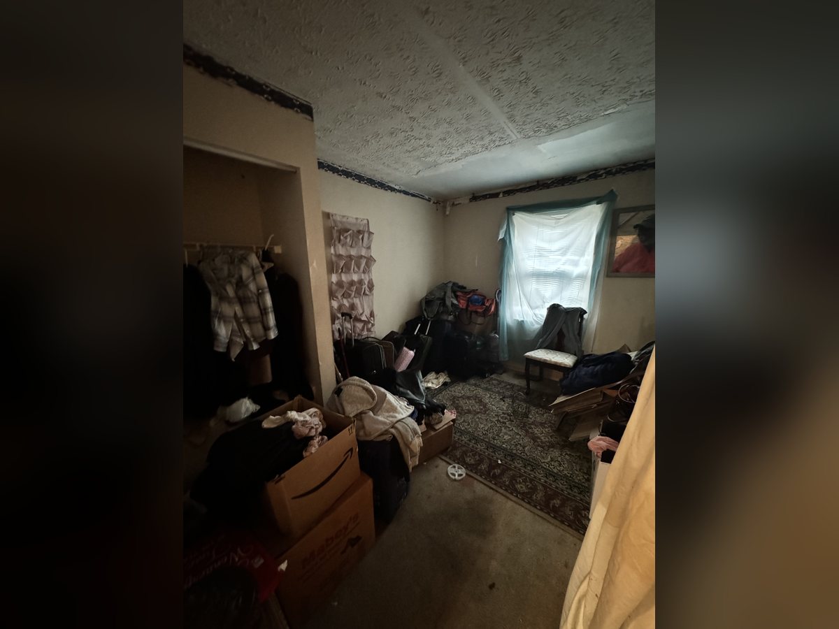 Bedroom packed with belongings
